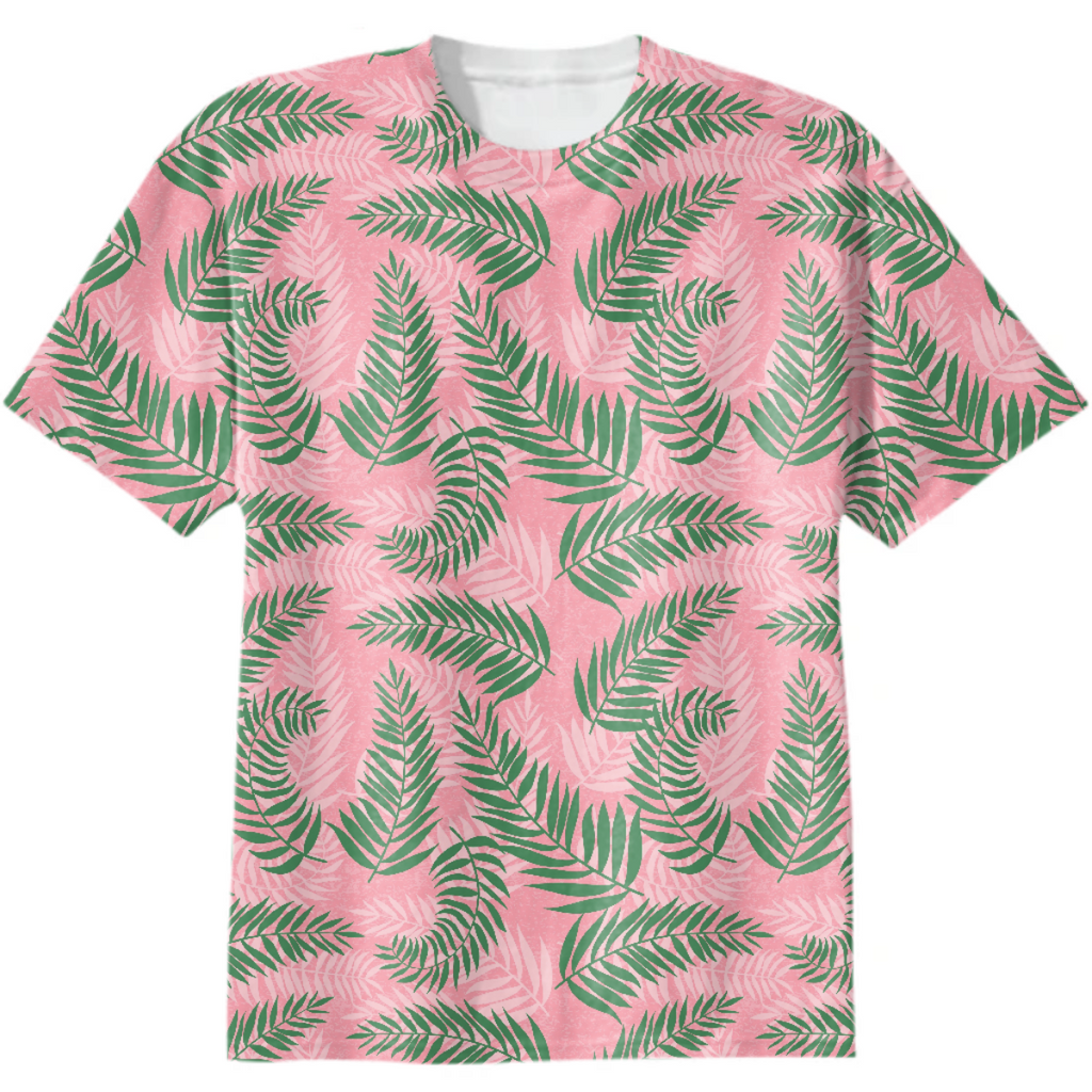 Green tropical palm leaves on pink background