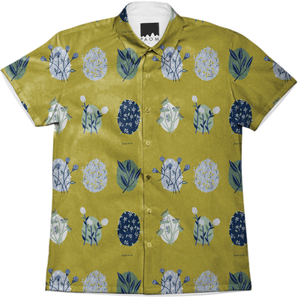 Sketched flowers in muted greens and blues on a mustard colored background.