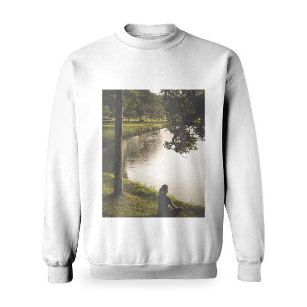 Woman Sitting On Grass By Lake Basic Sweatshirt