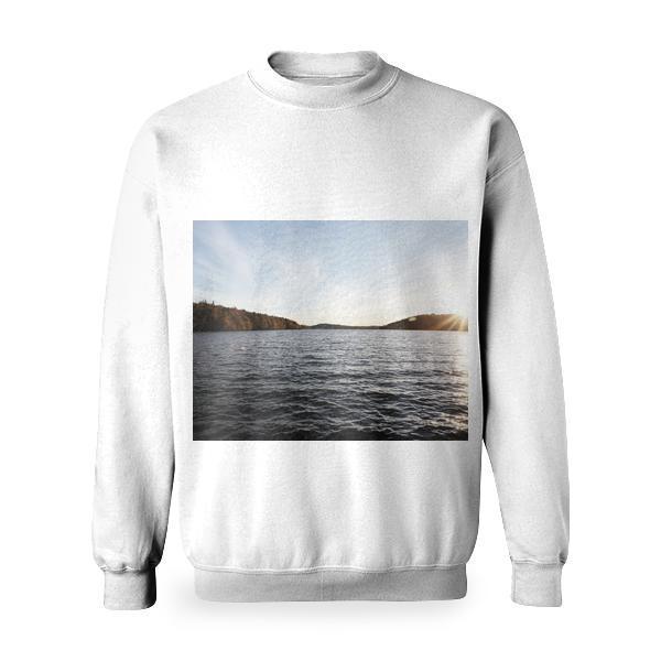 Body Of Water Surrounded By Green And Brown Forest Trees Under Blue White Skies During Sunset Basic Sweatshirt
