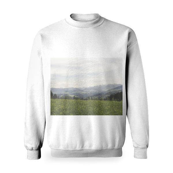 Green Grass Field Under Grey Clear Sky Overlooking Mountains Basic Sweatshirt