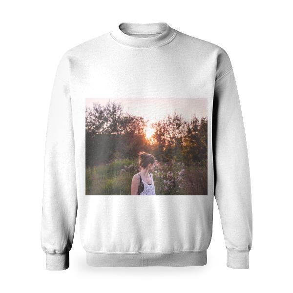 Selective Focus Photography Of Woman Standing In The Middle Grasses And Flowers During Golden Hour Basic Sweatshirt
