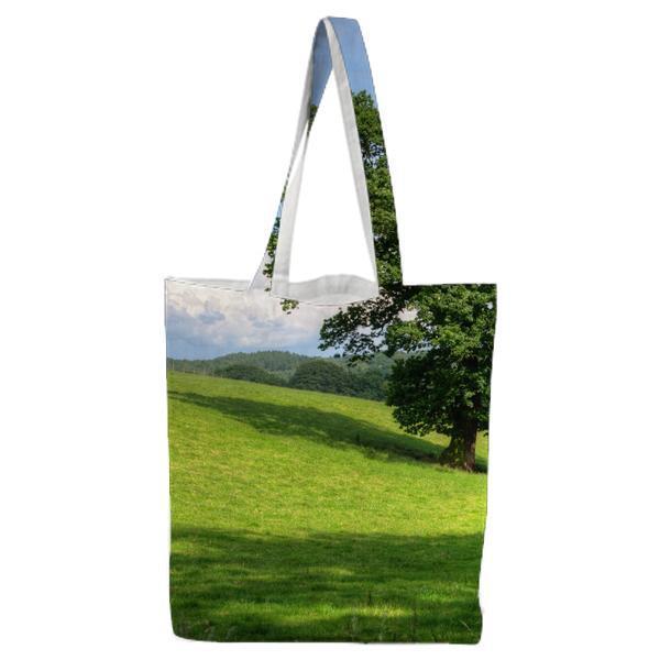 Green Tree On Grass Field During Daytime Tote Bag