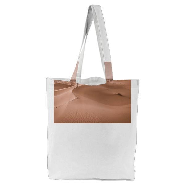 Person Walking In The Middle Of Dessert During Daytimre Tote Bag