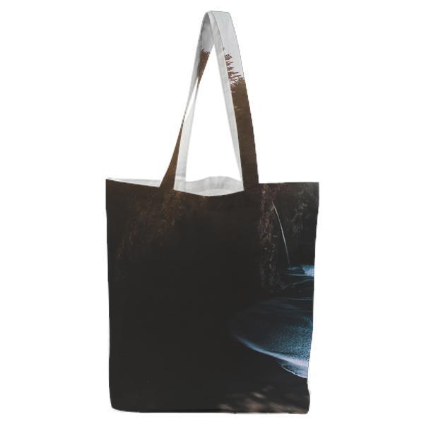 Blue Sea Near High Rise Rock During Daytime Tote Bag