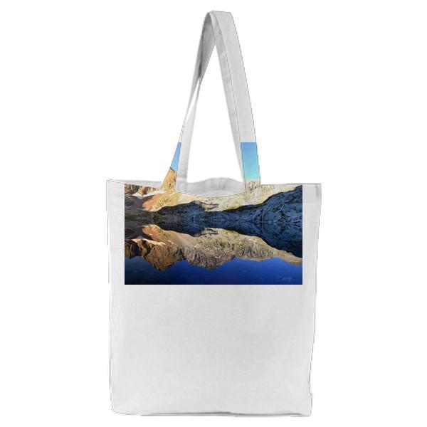 Brown Mountain Near Body Of Water During Daytime Tote Bag