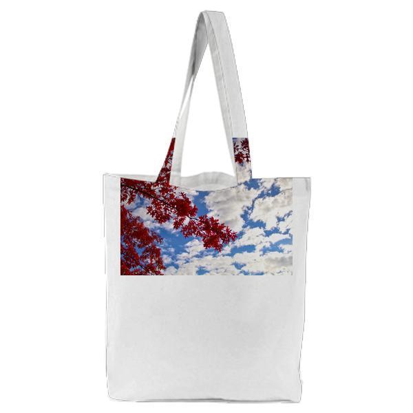 Low Angle Photography Of Red Leaf Tree Under Cloudy Blue Sky During Daytime Tote Bag