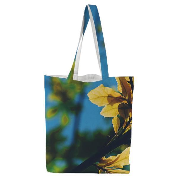 Selective Focus Photography Of Yellow Leaf Tree During Daytime Under Blue Sky Tote Bag