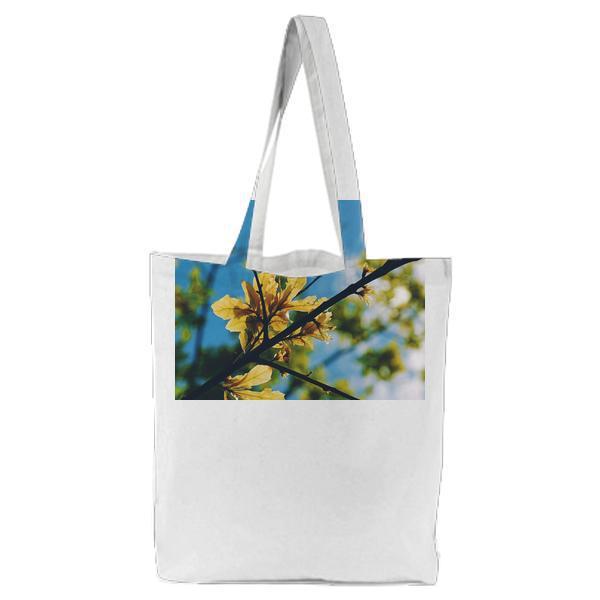 Selective Focus Photography Of Yellow Leaf Tree During Daytime Under Blue Sky Tote Bag