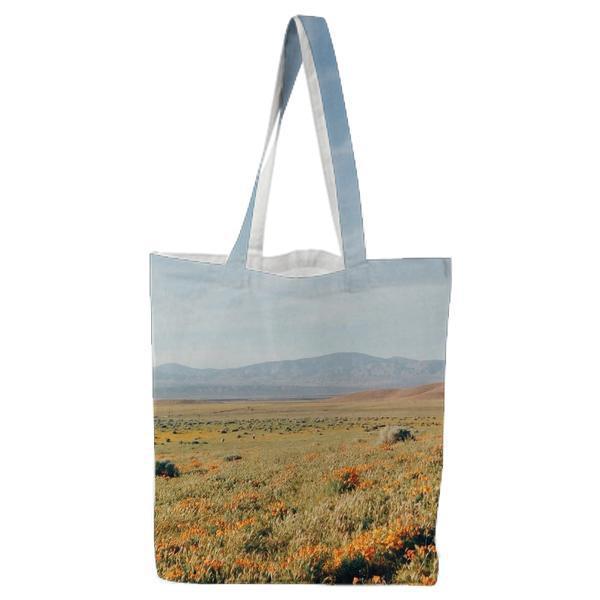 Woman In White Sundress Standing On Flower Field During Daytime Tote Bag