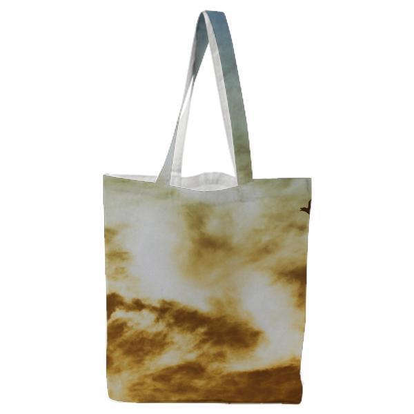 Bird Flying On Cloudy Sky Tote Bag