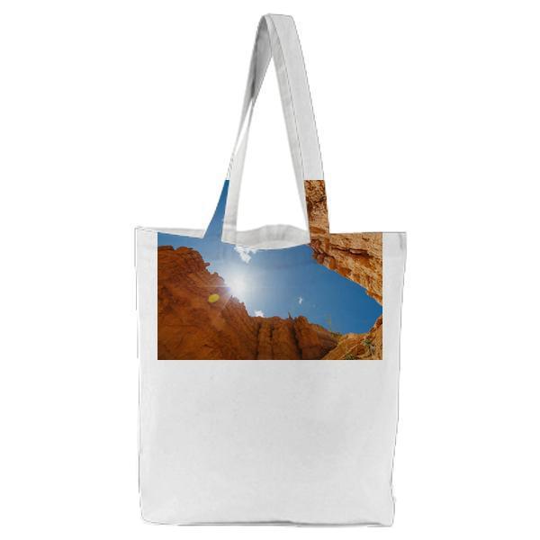 Looking Up Red Rock Desert Cliffs To The Sun Tote Bag
