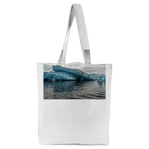 Iceberg Surrounded By Body Of Water Tote Bag