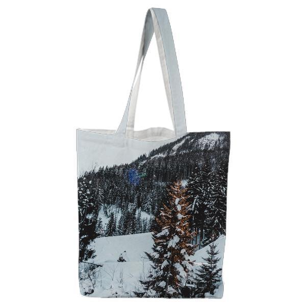 Snow Covered Trees Against Sky Tote Bag