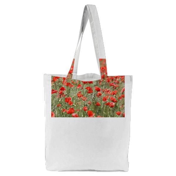 Red Flowers On Garden During Daytime Tote Bag