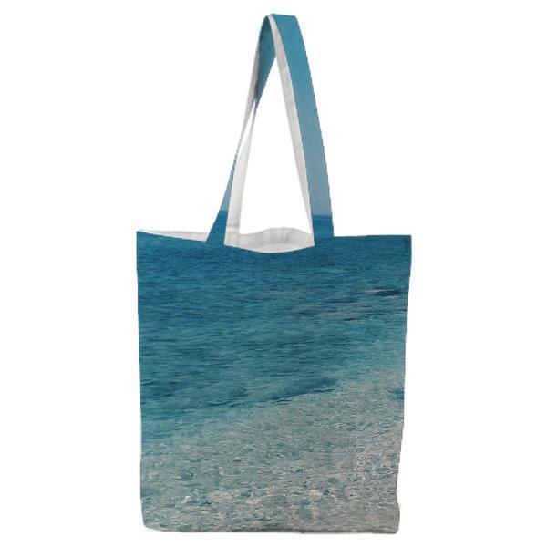 Grey Rock Formation Near Blue Beach During Daytime Tote Bag