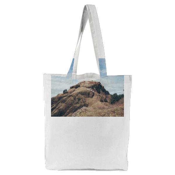 Photo Of Brown Mountain During Daytime Tote Bag