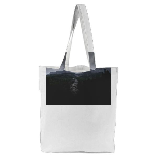 River Between Trees And Mountains Under Grey Clouds During Daytime Tote Bag