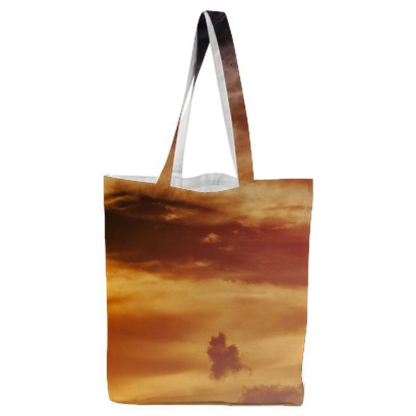 Black Bird Flying Under Black And White Clouded Sky At Daytime Tote Bag
