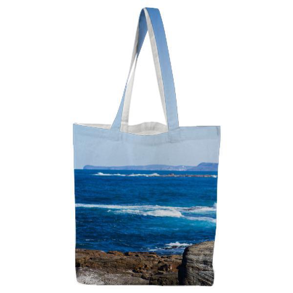 Brown Grey Stone Formation At The Sea Shore During Daytime Tote Bag