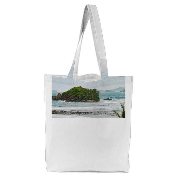 Rock Formation Near Body Of Water During Daytime Tote Bag