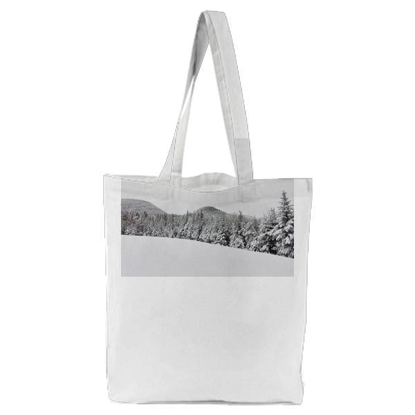 Green Trees On Snow Ground At Daytime Tote Bag