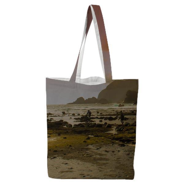 Beach Beside Mountain During Daytime Tote Bag