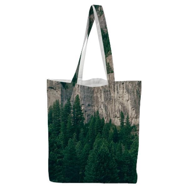 Green Trees Near White Mountain During Daytime Tote Bag