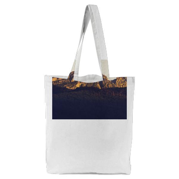 Rocky Mountain Surrounded Green Leaf Tree During Daytime Tote Bag