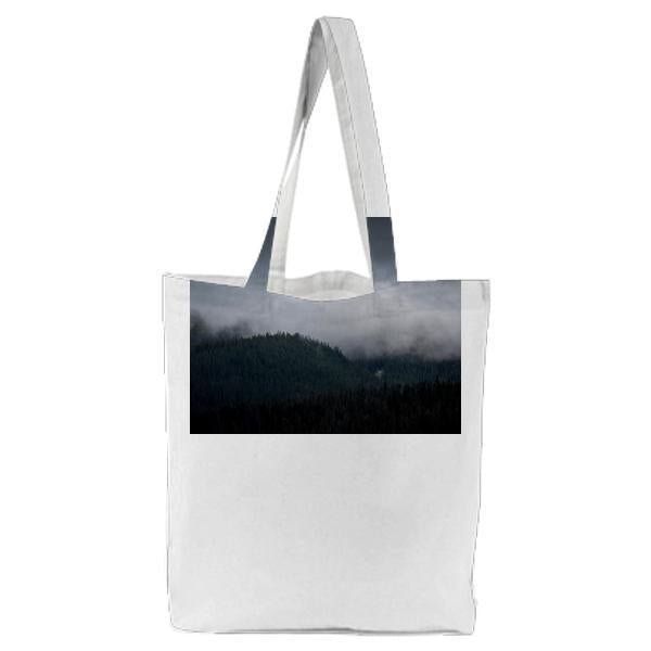 Mountain Covered With Trees And Fogs Tote Bag