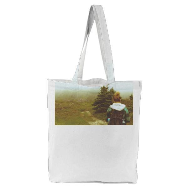 Woman In Black Blue And White Hoodie Near Green Pine Tree Tote Bag