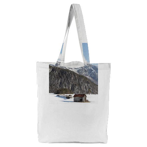 Brown Wooden House Far High Rise Mountain During Daytime Tote Bag