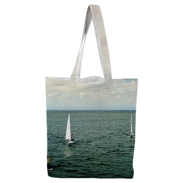 White Sail Boat On Body Of Water Under Blue Cloudy Sky During Daytime Tote Bag