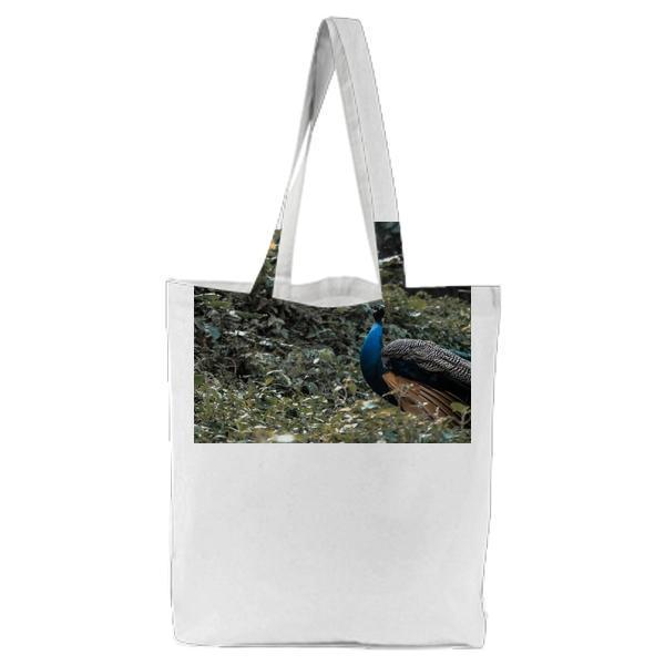 Blue Peacock On Green Grass Field During Daytime Tote Bag