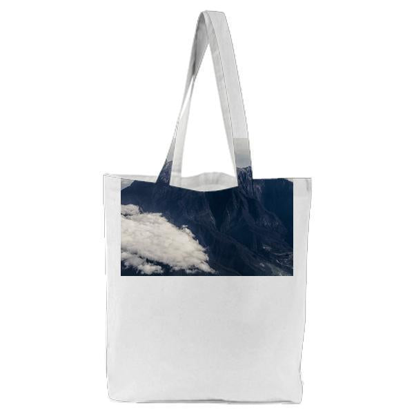 White Clouds Near Gray Mountain At Daytime Tote Bag
