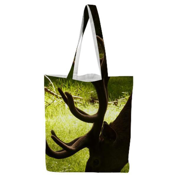 Deer Eating Grass During Daytime Tote Bag
