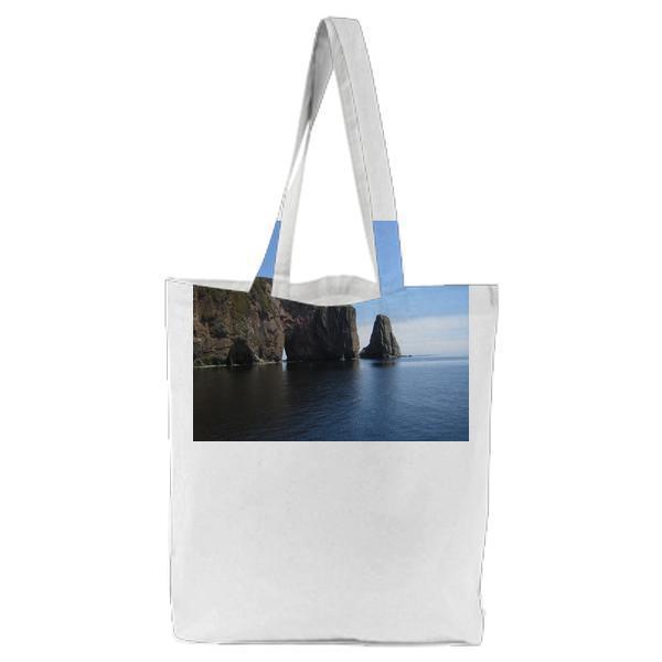 Grey Cliff On Blue Calm Sea During Daytime Tote Bag
