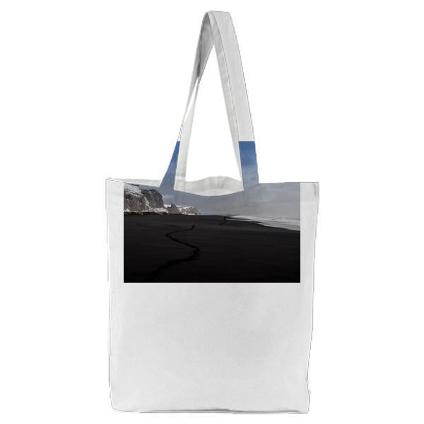 Black Sand Near Seashore During Daytime Tote Bag