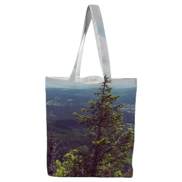 Green Trees Near Mountain Under White And Blue Sky Tote Bag