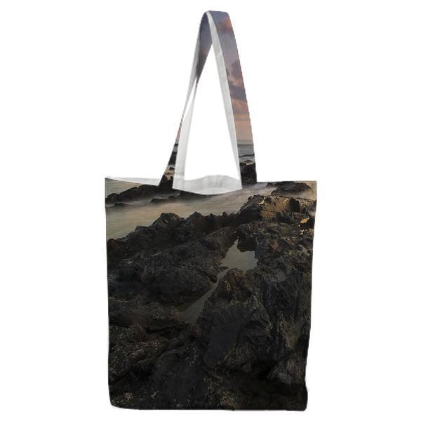Black Rocks Surrounded By Body Of Water During Daytime Tote Bag