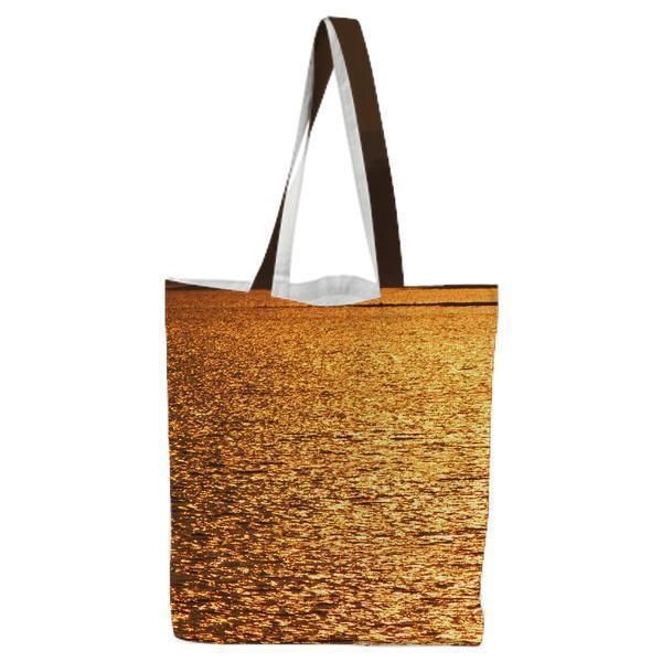Blue Sea Near Brown Mountain During Sunset Tote Bag