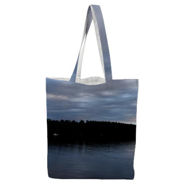 Silhouette Of Tress Beside Body Water On Cloudy Day Tote Bag
