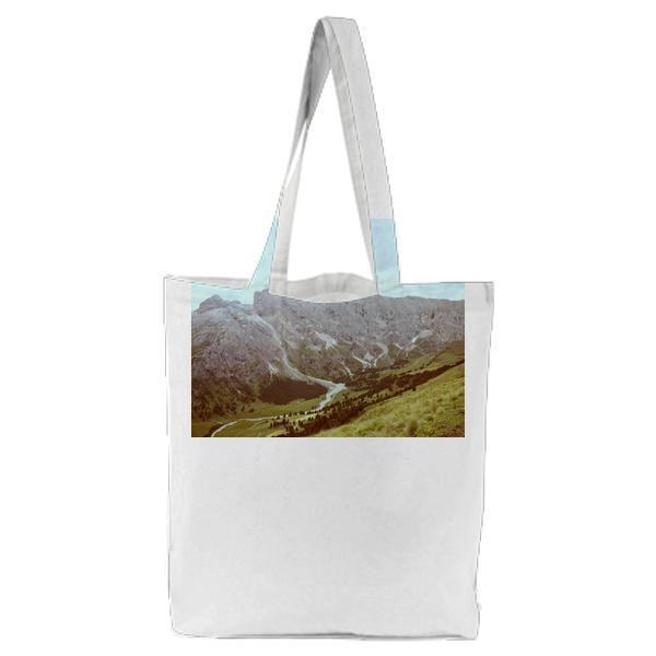 Grey Formation Of Rock Mountain By The Green Field During Daytime Tote Bag