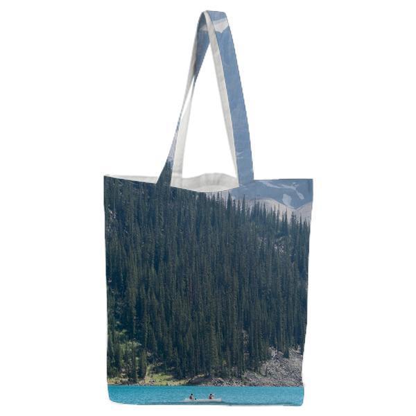 Boat On Sea Near Trees During Daytime Tote Bag
