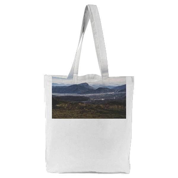 Gray Mountains And Brown Green Weeds Grass Tote Bag