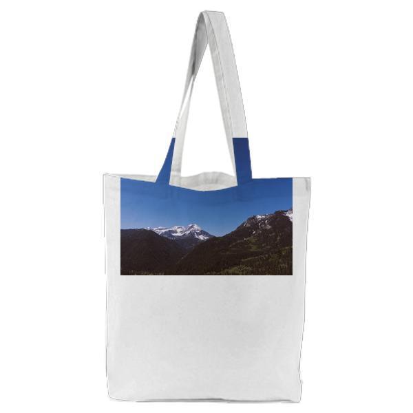 Green Trees Near Mountain At Daytime Tote Bag