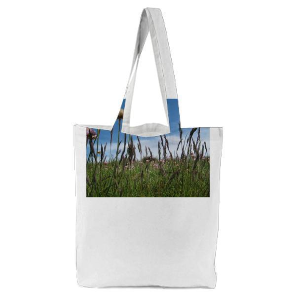 Pink Flower On Green Field Under White And Blue Sky During Daytime Tote Bag