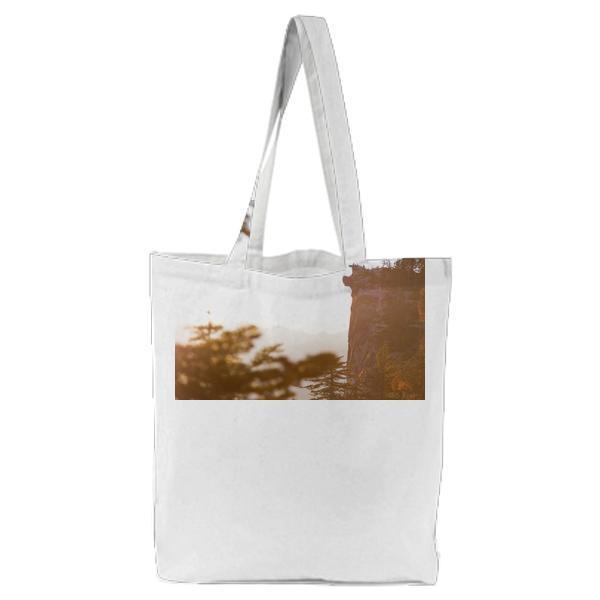 Green Leaved Tree On Black Surface During Daytime Tote Bag
