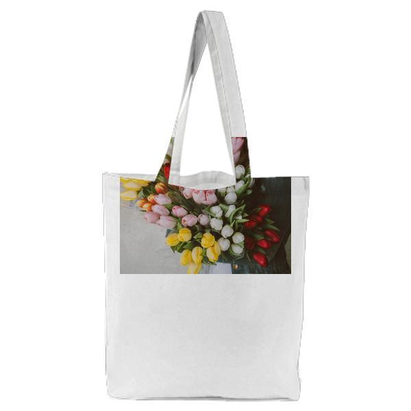 Woman Holding Pink White Red And Yellow Tulips Tote Bag