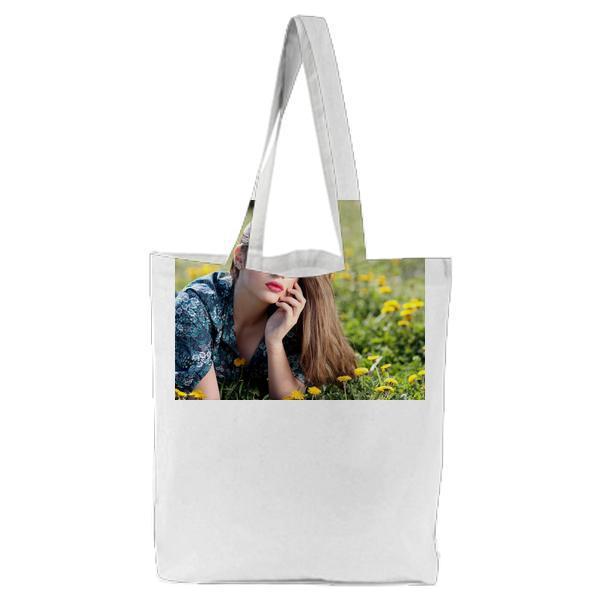 Girl Lying On Yellow Flower Field During Daytime Tote Bag
